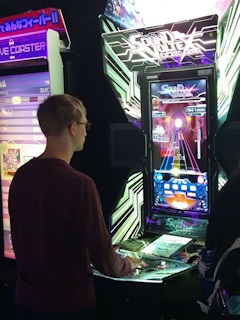 A photo of isocosa's boyfriend playing Sound Voltex Exceed Gear